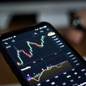 Close up shot of RTP and volatility charts displayed on a mobile screen.